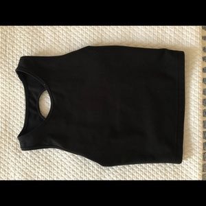 Strong Physiquez black tank top.